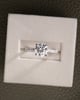 Platinum | 7.5mm Round Moissanite | Lab Diamond side stones