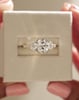 18k Yellow Gold / Platinum | High Set | 8x6mm Elongated Cushion Moissanite | Moissanite side stones