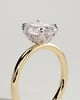 Aurelie - Oval 4 Claw Solitaire with Petal Gallery and Accent Leaf Detail Engagement Ring - 18k Yellow Gold / 18k White Gold