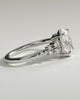 Bella - Oval Claw Solitaire with Clustered Round Shoulder Stones Engagement Ring - 18k White Gold