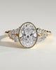 Oval Bezel Solitaire with Clustered Round-Marquise Mixed Set Shoulder Stones Engagement Ring - 18k Yellow Gold