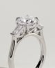 Marina - Round Claw Trilogy with Tapered Baguette Side Stones and Cathedral Setting Engagement Ring - 18k White Gold