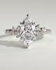 Minnie - Marquise Solitaire with Clustered Round Accent Stones - 18k White Gold