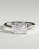 Zara - Radiant 4 Claw Solitaire with East West Setting and Raised Basket Gallery Engagement Ring - 18k White Gold