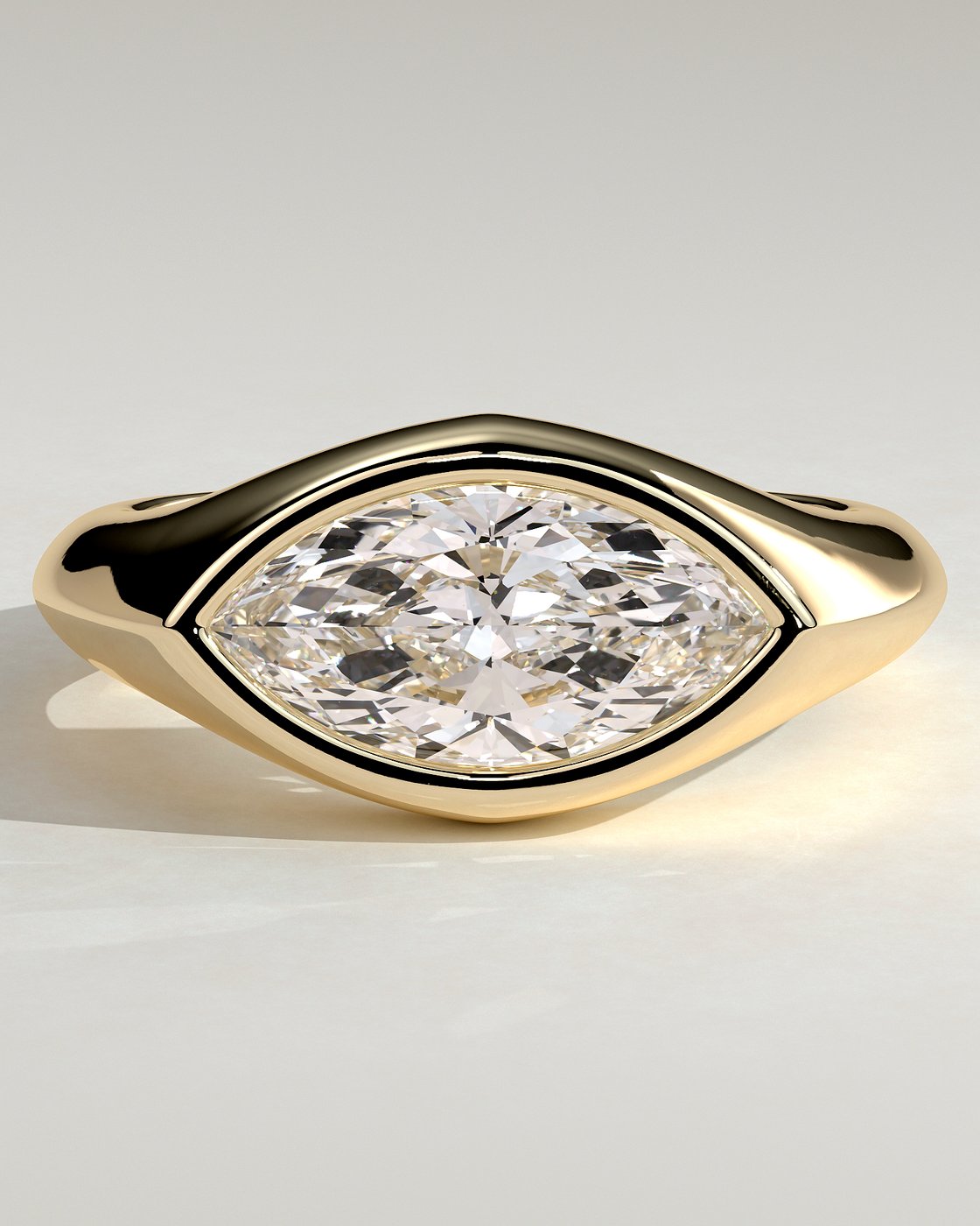 Angie Marquise East West Bezel Solitaire