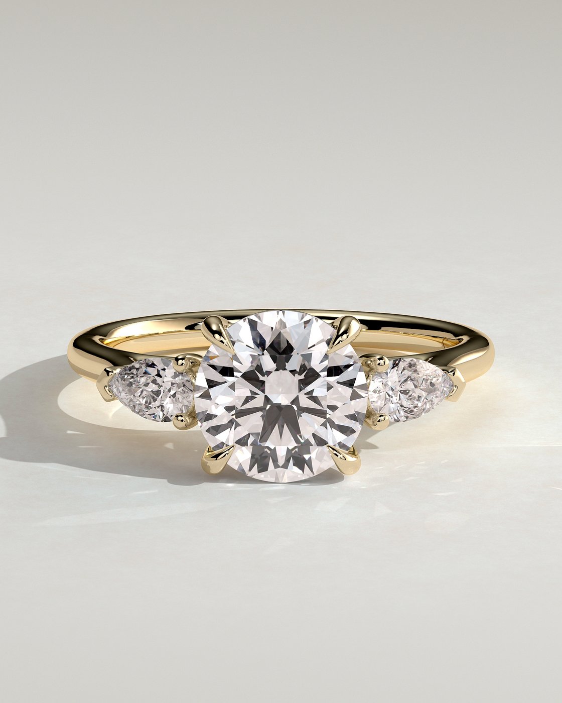 Arya Round Trilogy with Pear Side Stones