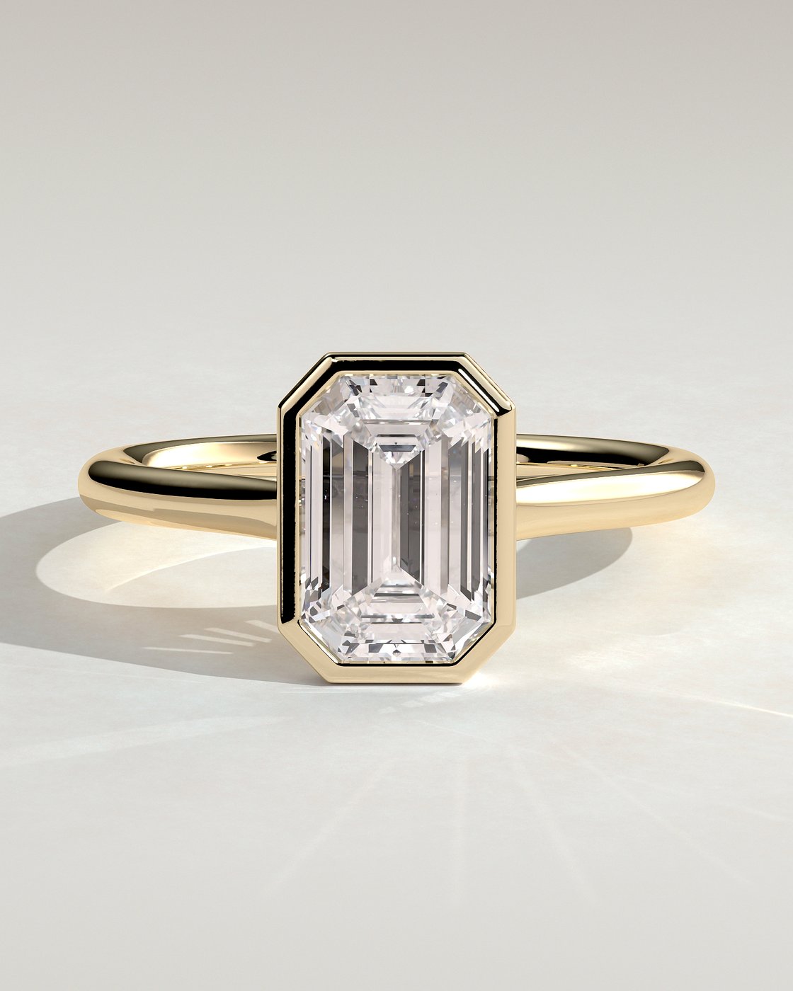 Imani Bezel Set Emerald Solitaire