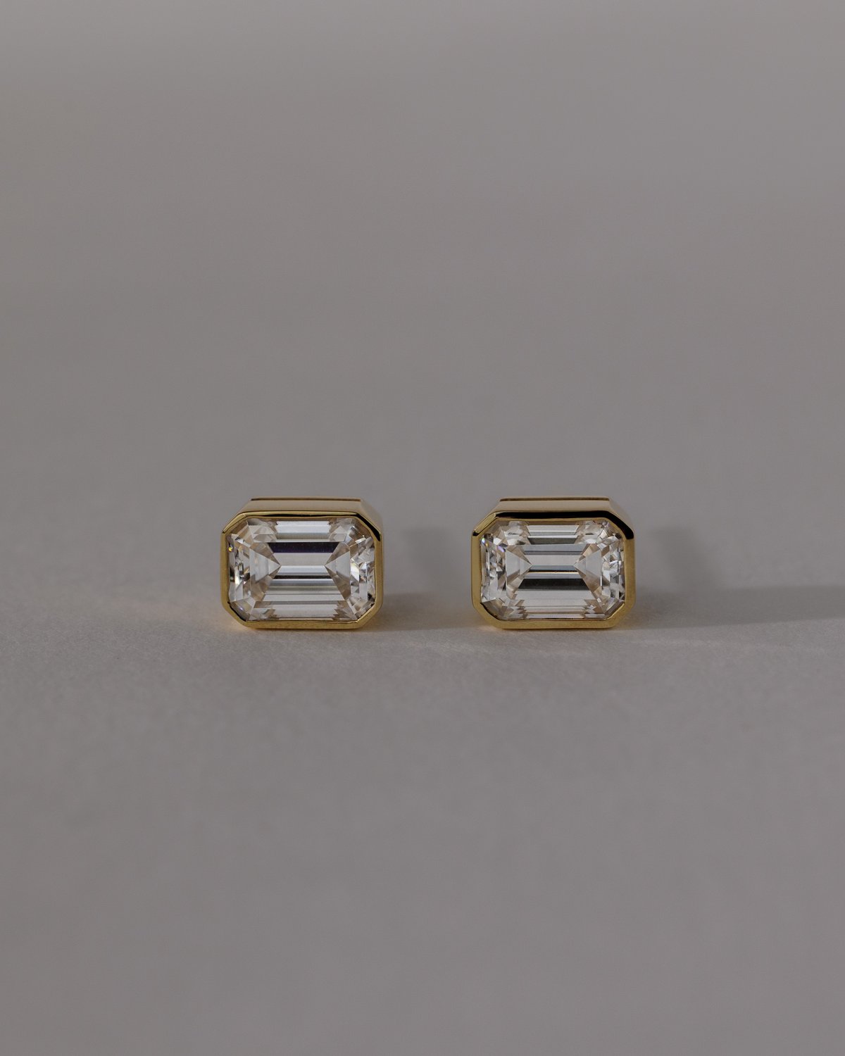 Kara - Emerald Bezel Earrings Lifestyle Image