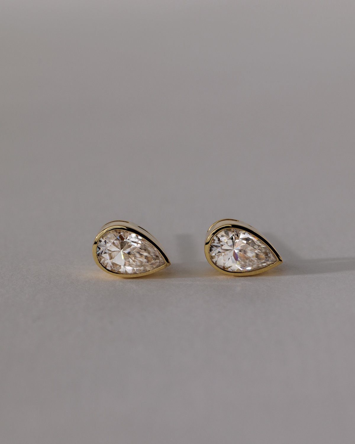 Lucia - Pear Bezel Earrings Lifestyle Image