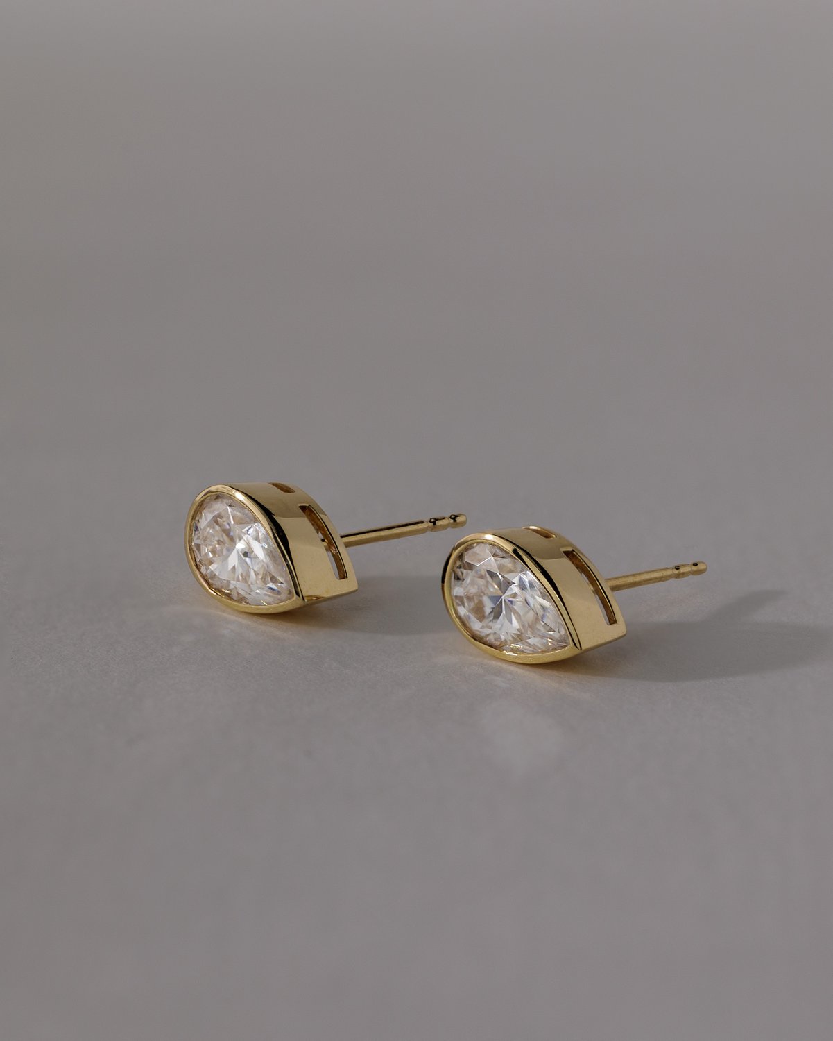 Lucia - Pear Bezel Earrings Lifestyle Image
