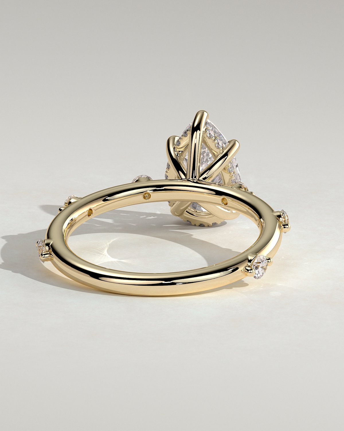 Amora - Pear Solitaire with Round Side Stones - 18k Yellow Gold