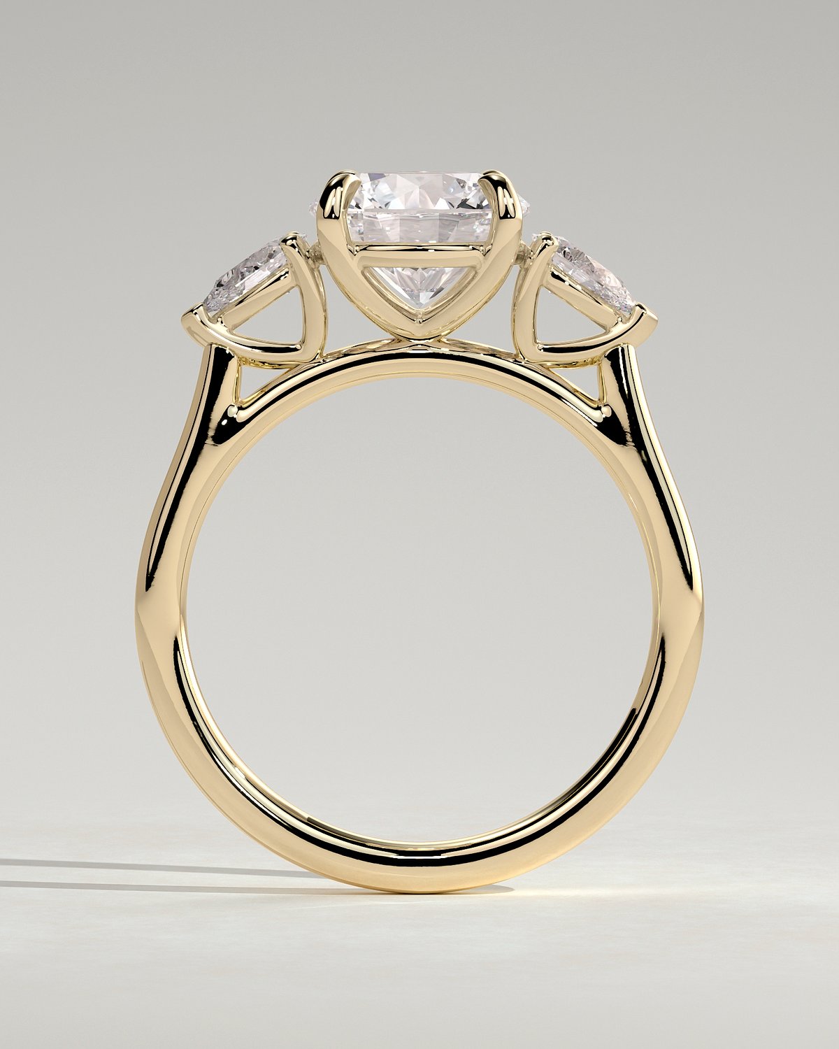 Arya - Round Trilogy with Pear Side Stones - 18k Yellow Gold