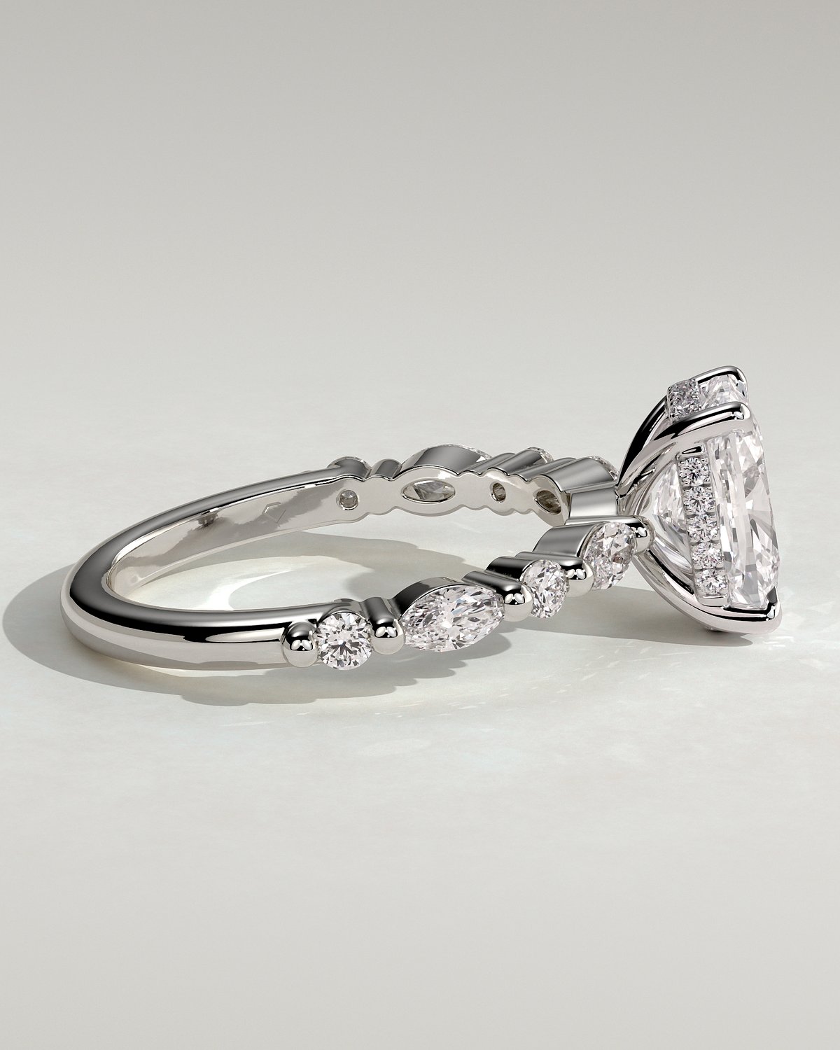 Cali - 4 Claw Elongated Cushion Solitaire with Accent Stones - 18k White Gold