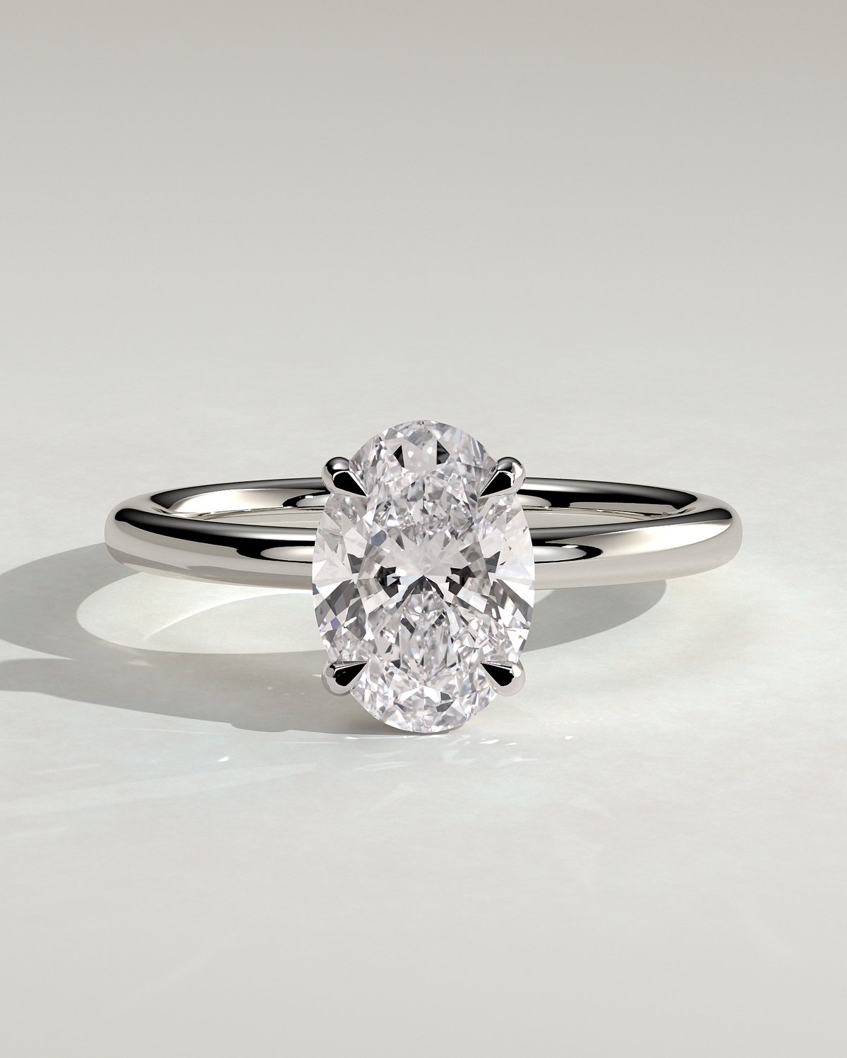 Daisy  Oval Solitaire - 18k White Gold High Setting