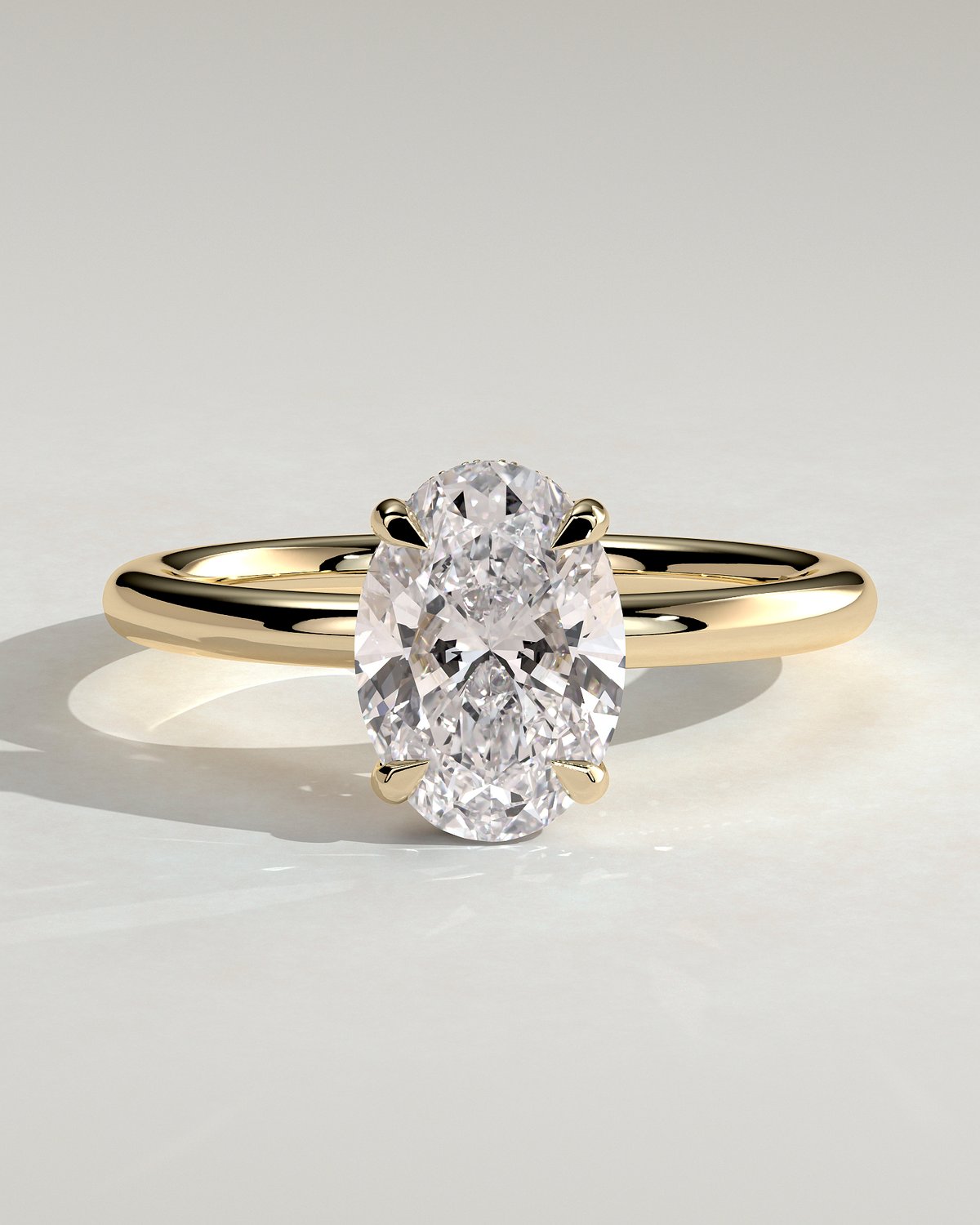 Emma  Oval Solitaire with Hidden Halo - 18k Yellow Gold High Setting