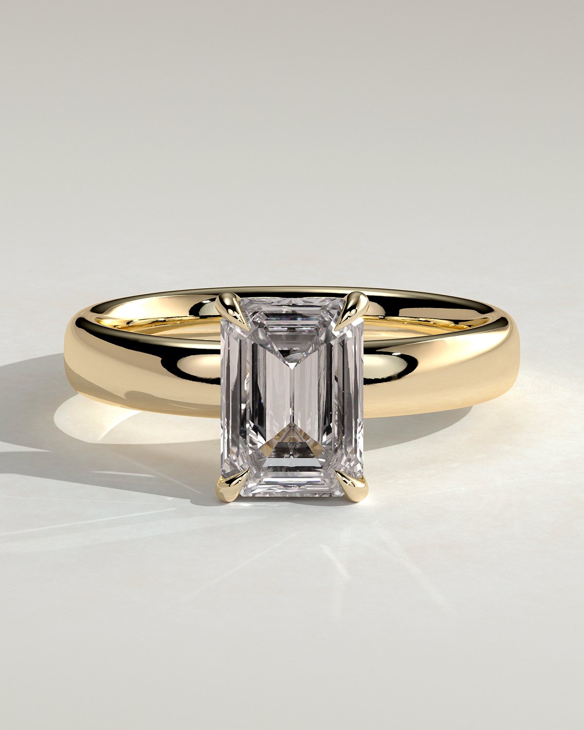 Kate - Emerald Solitaire with Cigar Band - 18k Yellow Gold High Setting