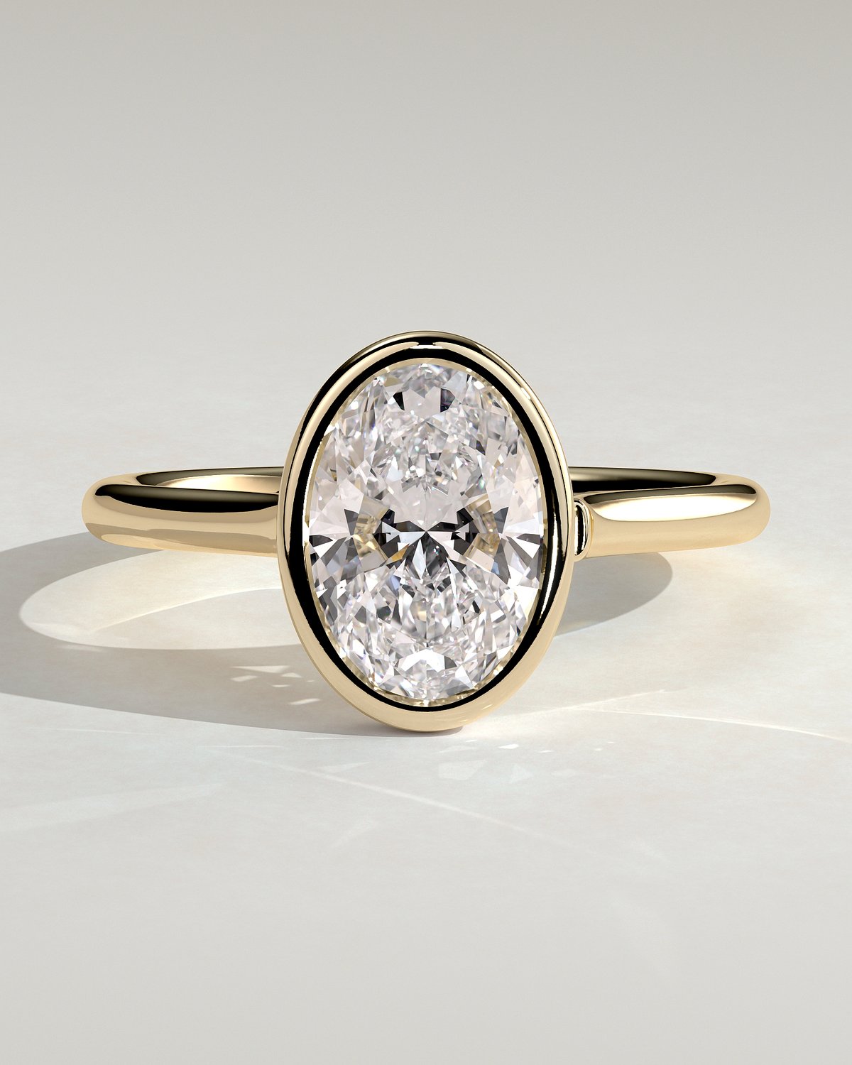 Lexie - Bezel Set Oval with Cathedral Setting - 18k Yellow Gold