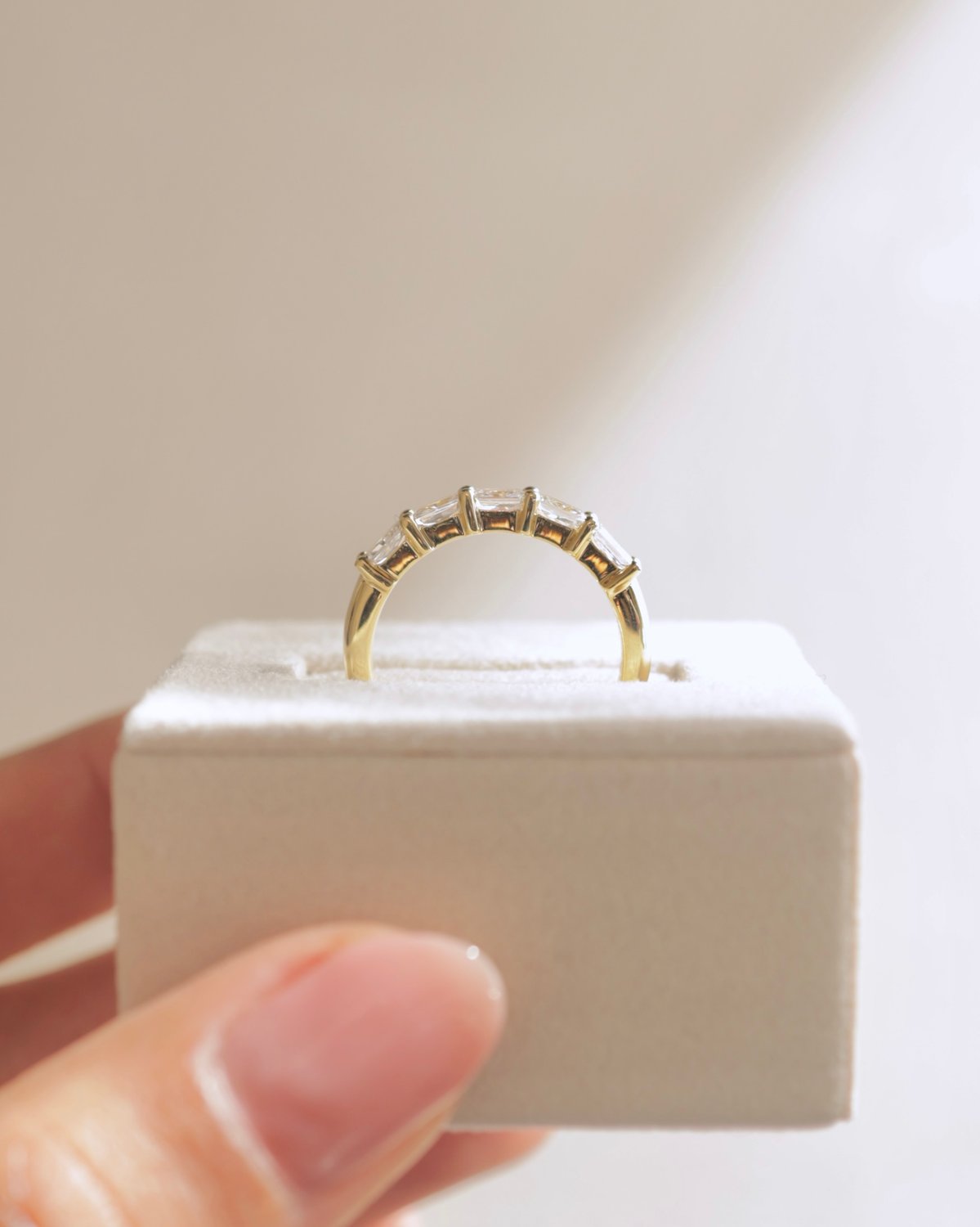 Maia - 5 Stone East West Radiant Wedding Band Lifestyle Image