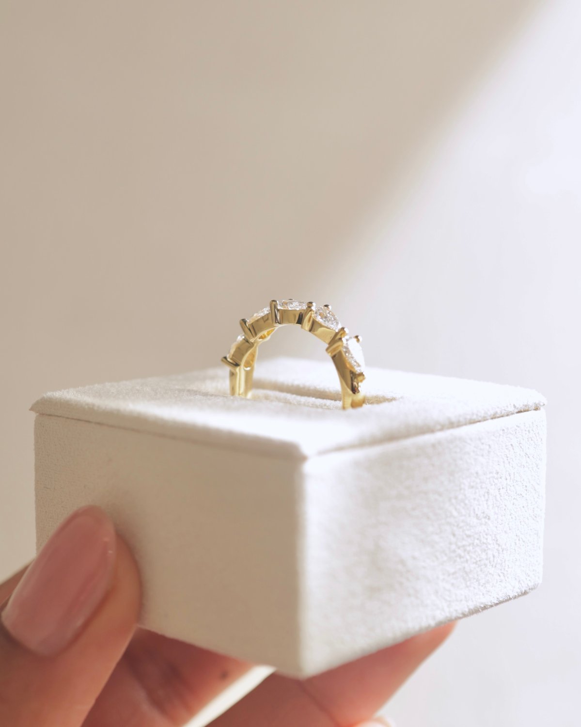 Narissa - 5 Stone East West Pear Wedding Band Lifestyle Image