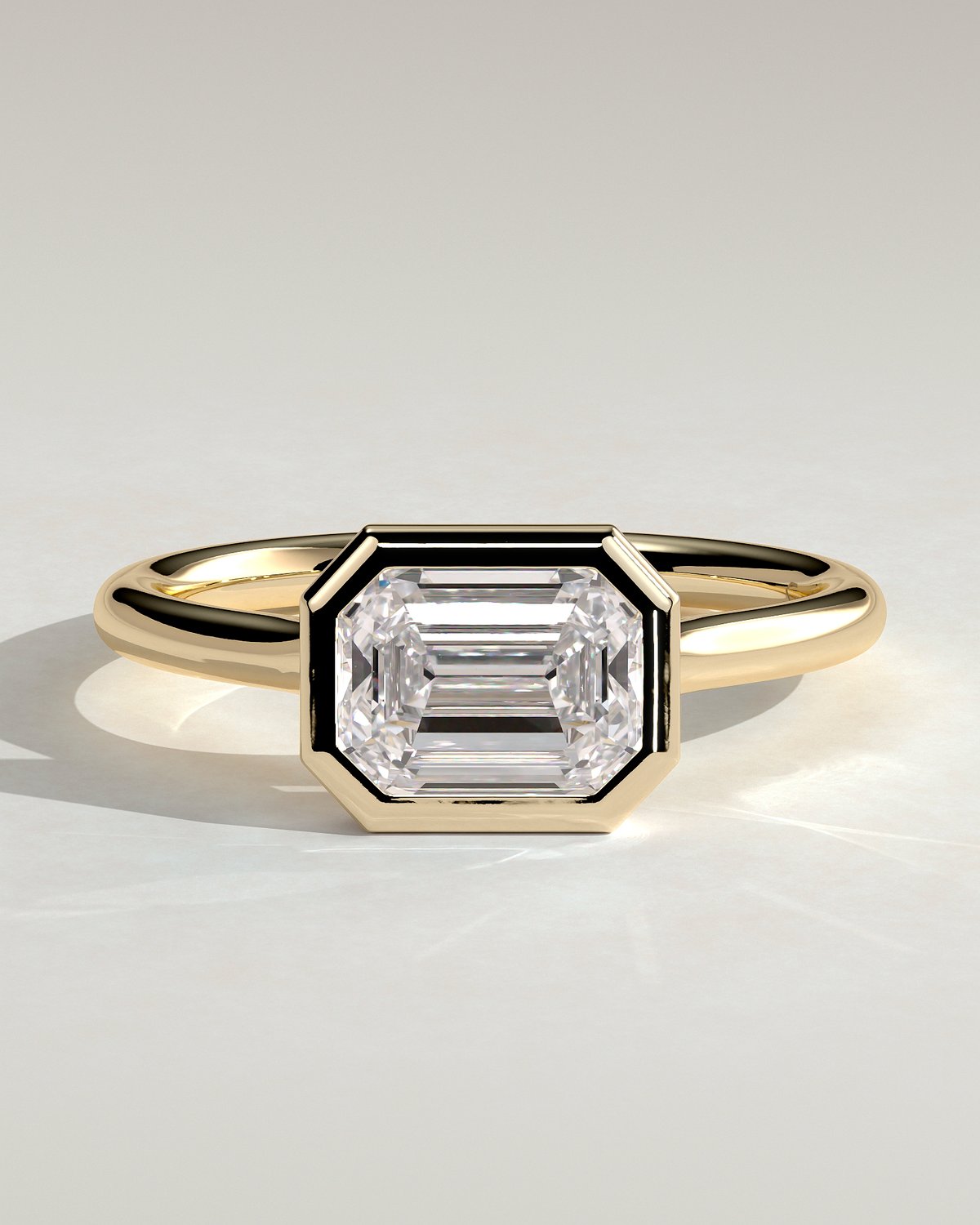 Olive - East West Emerald Solitaire with Cathedral Bezel Setting - 18k Yellow Gold
