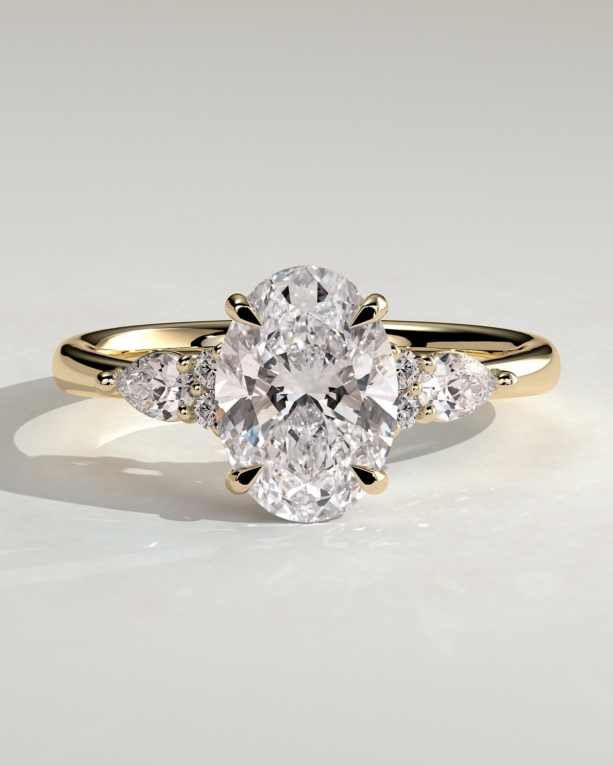 Sheridan  Oval Trilogy with Round and Pear Stones - 18k Yellow Gold Low Setting