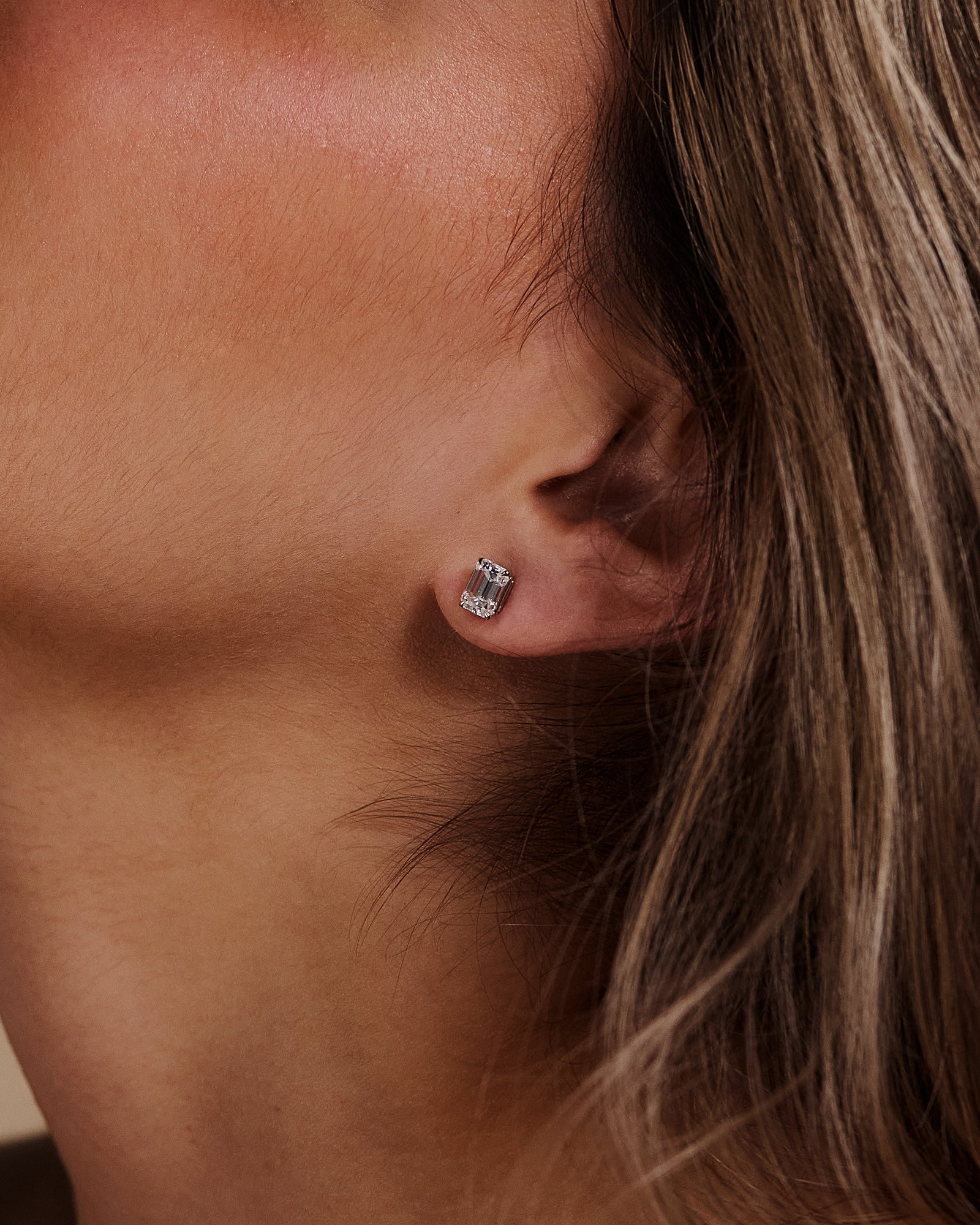 Barbara - Emerald 4 Claw Earrings Lifestyle Image