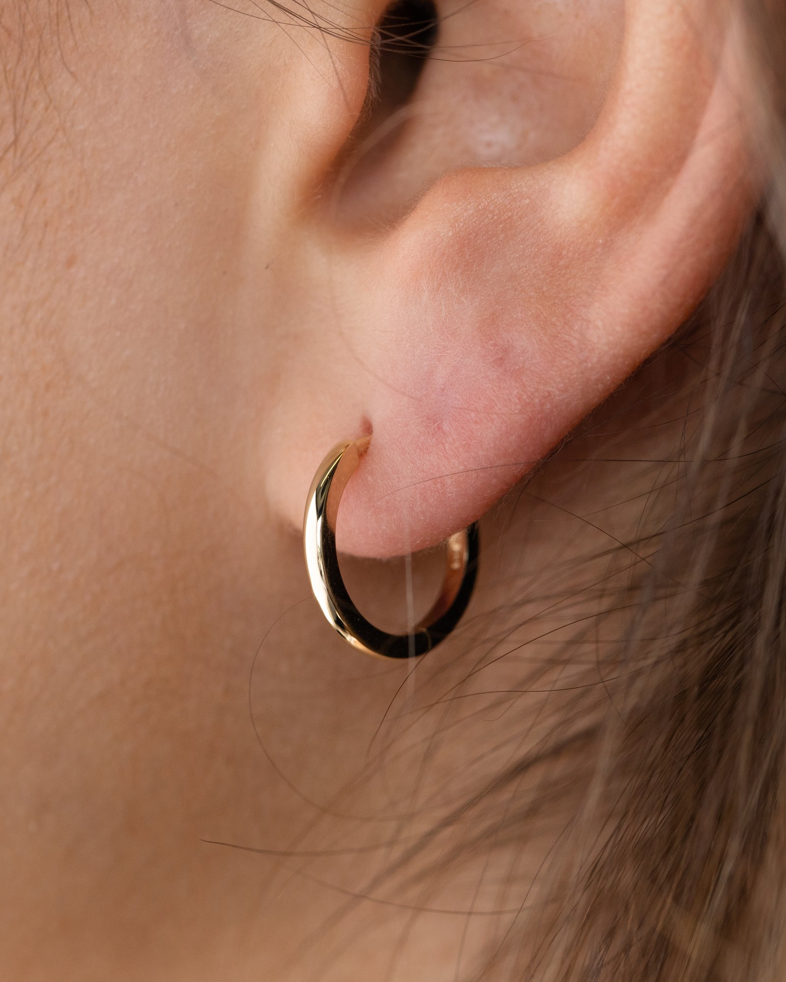 Emmeline - Huggie Hoop Earrings Lifestyle Image
