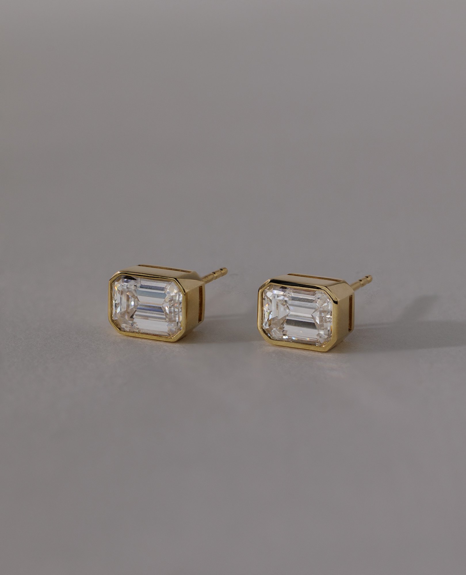 Kara - Emerald Bezel Earrings Lifestyle Image