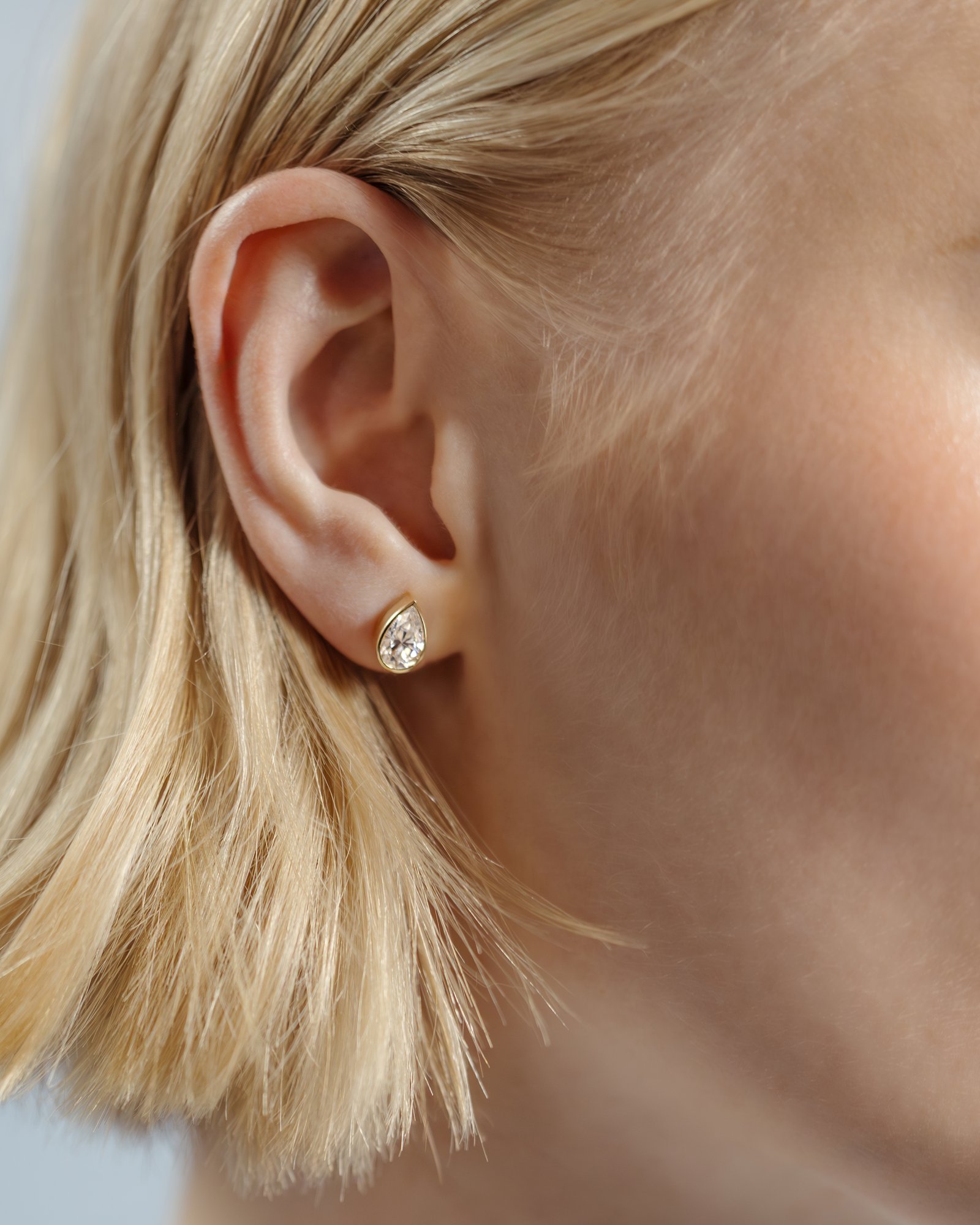 Lucia - Pear Bezel Earrings Lifestyle Image