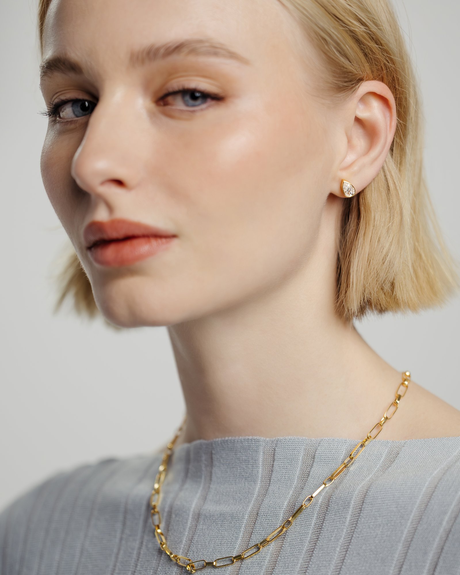 Lucia - Pear Bezel Earrings Lifestyle Image