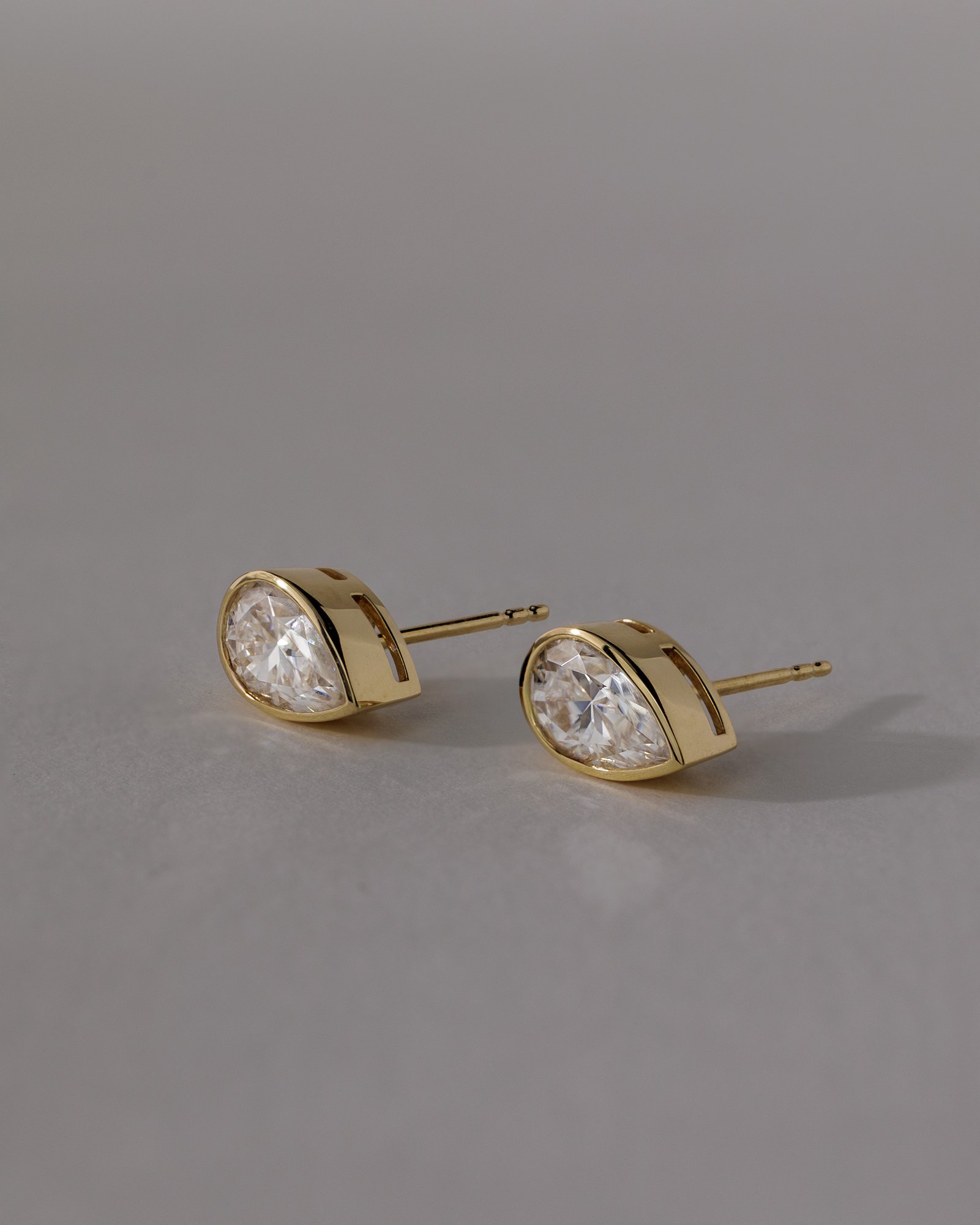 Lucia - Pear Bezel Earrings Lifestyle Image