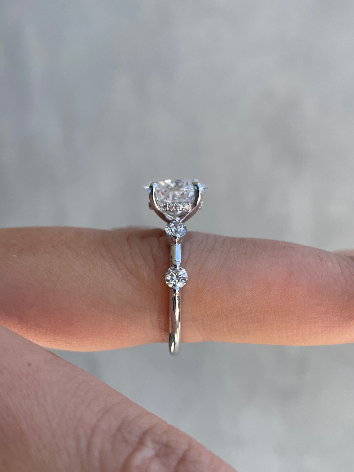 Platinum | 10x7mm Oval Moissanite | Lab Diamond side stones