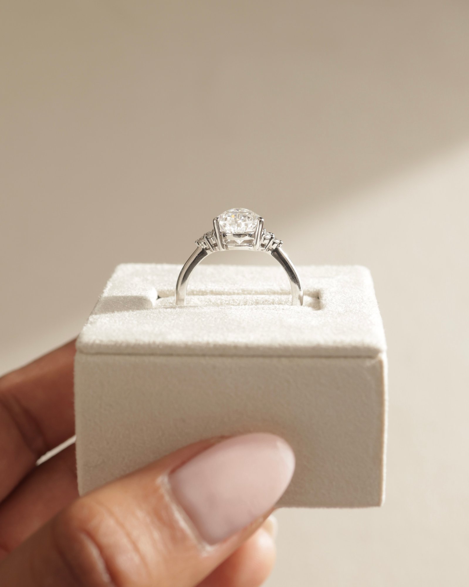 Platinum | 10x7mm Pear Moissanite | Lab Diamond side stones