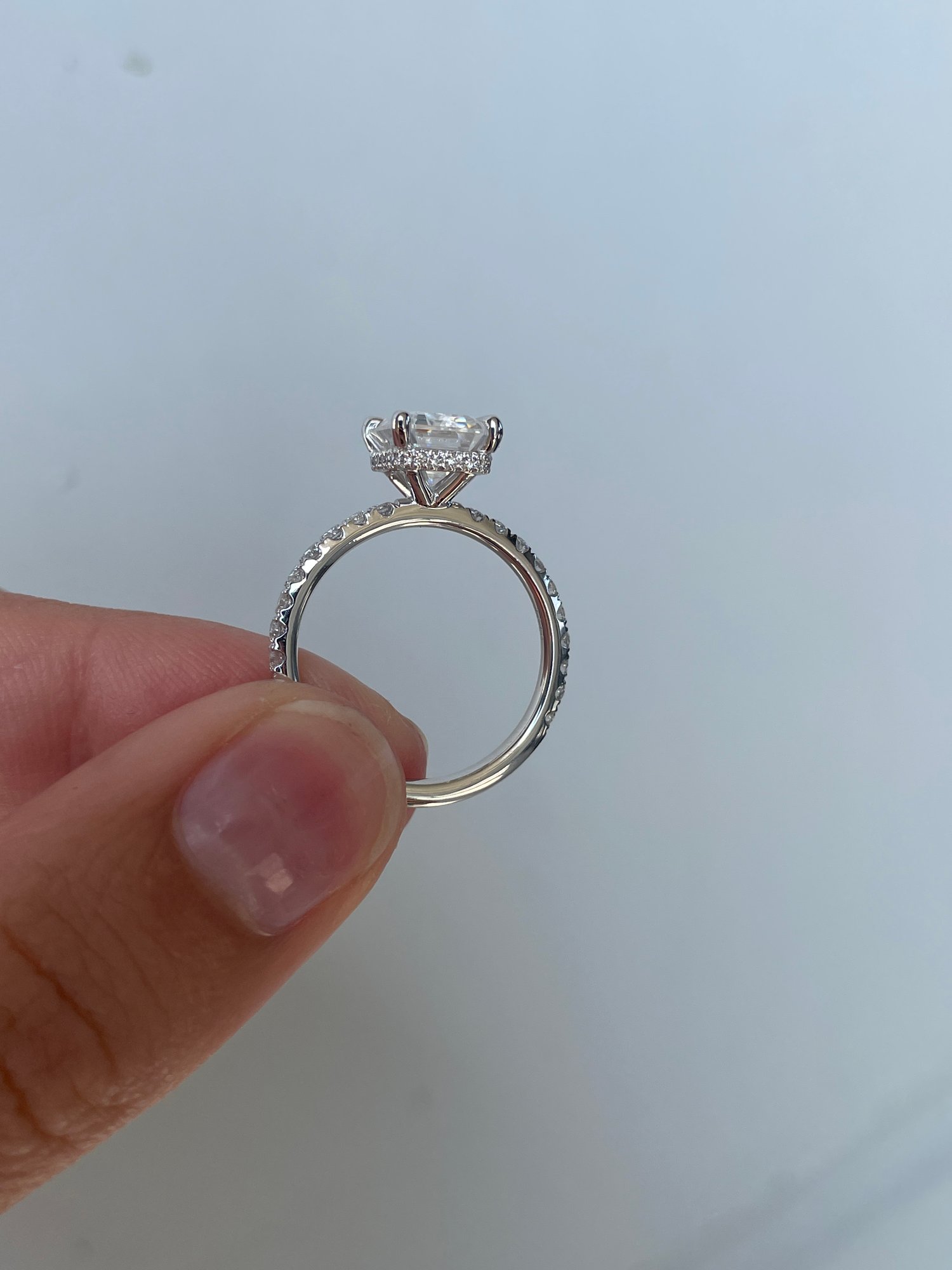 Platinum | 9x7mm Emerald Moissanite | Lab Diamond side stones