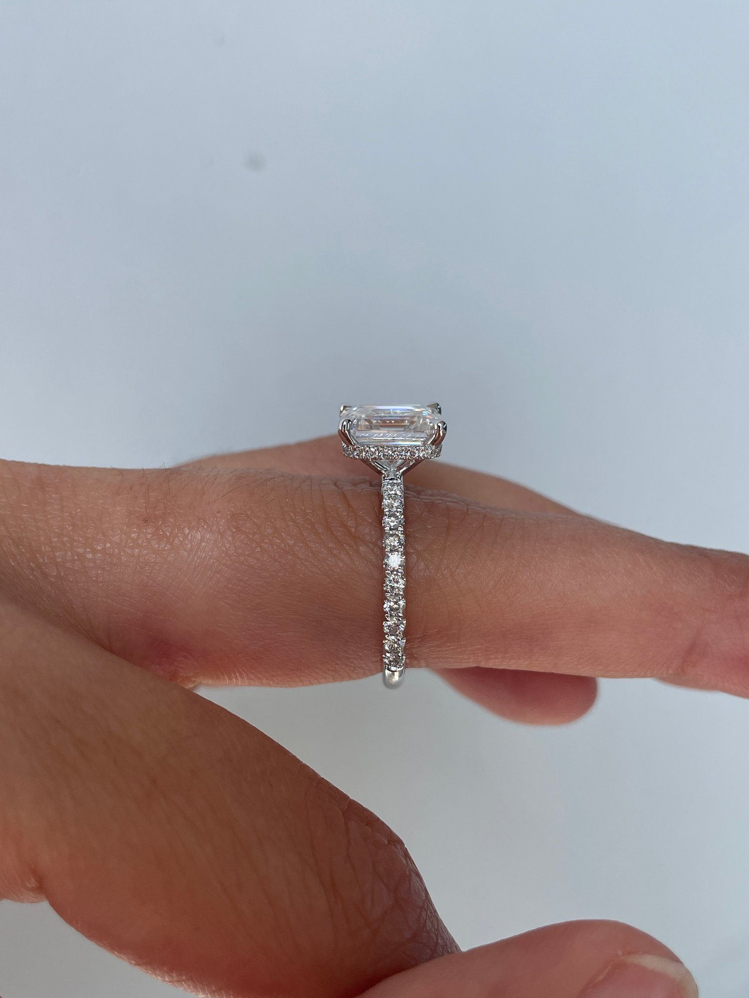 Platinum | 9x7mm Emerald Moissanite | Lab Diamond side stones