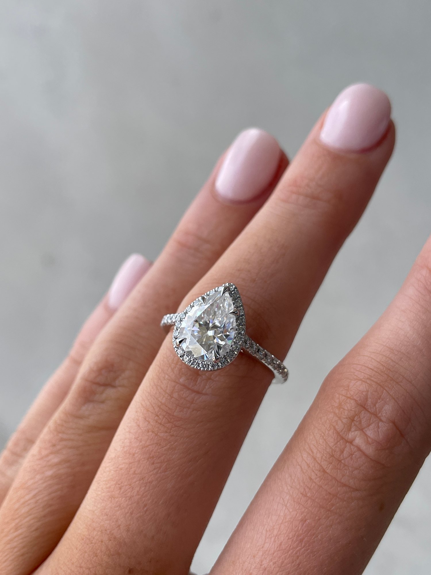 Platinum | 10x7mm Pear Moissanite | Lab Diamond side stones