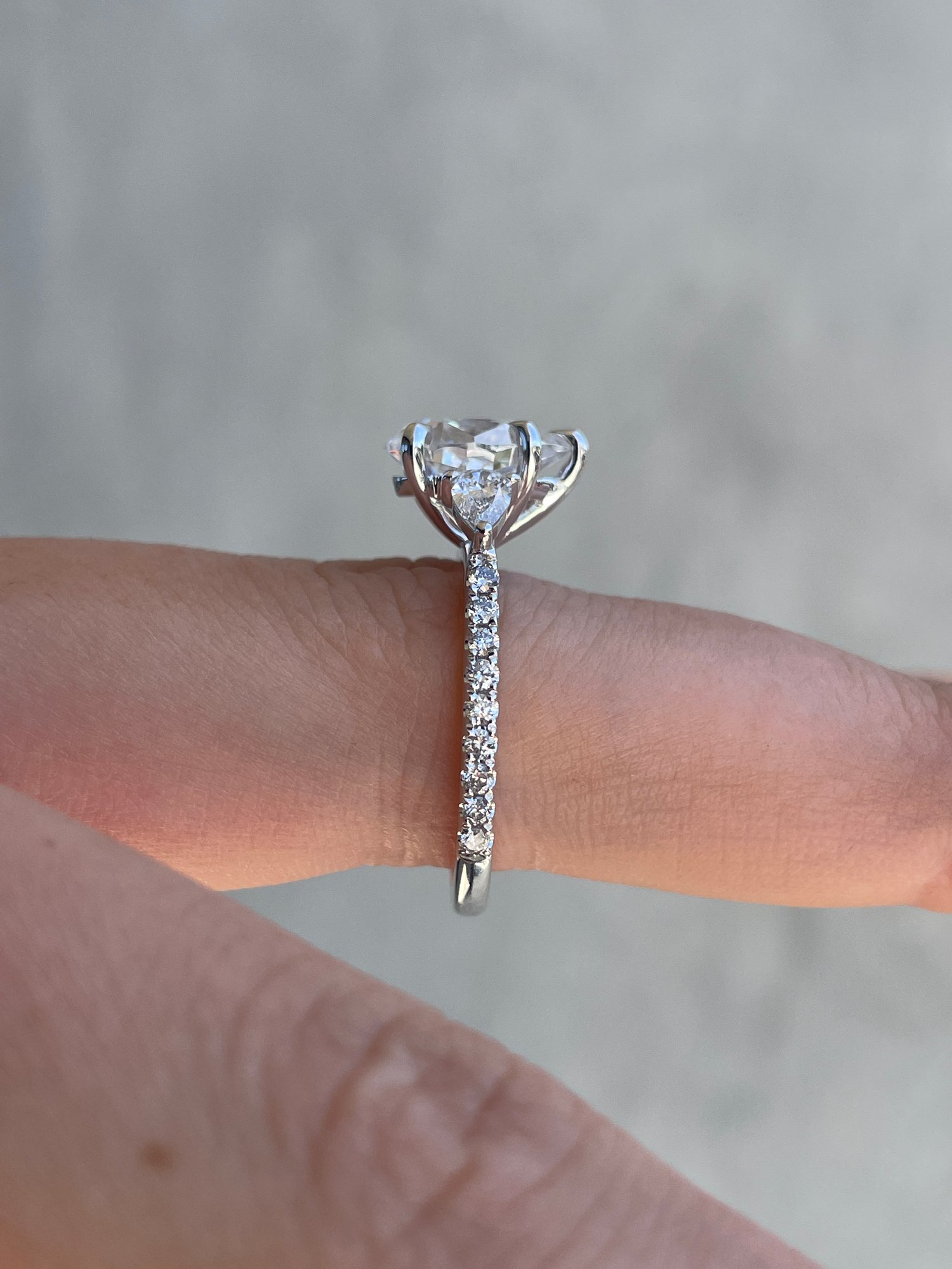 Platinum | 10x7mm Pear Moissanite | Lab Diamond side stones