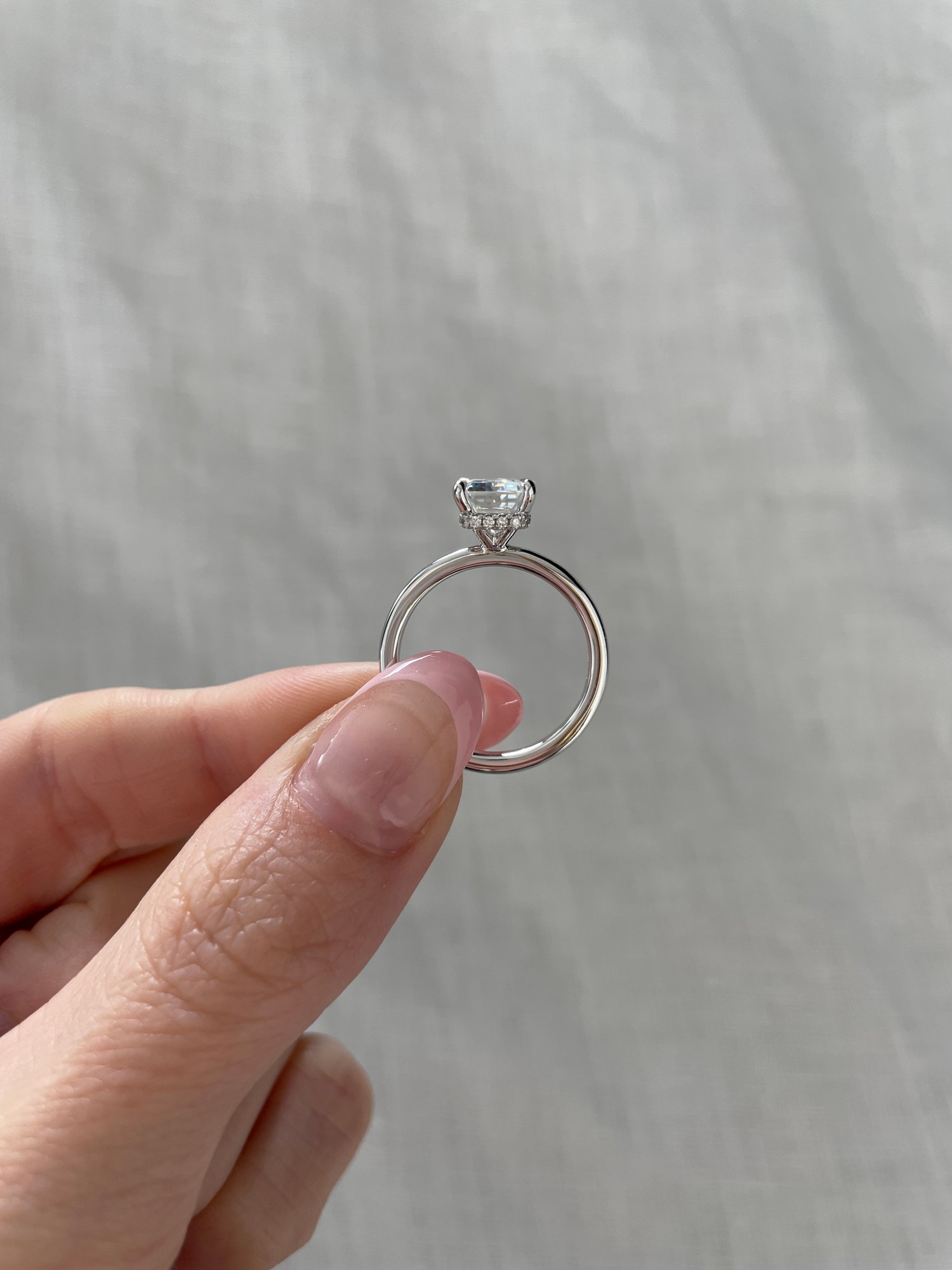 Platinum | 8.5x6.5mm Emerald Moissanite | Lab Diamond side stones