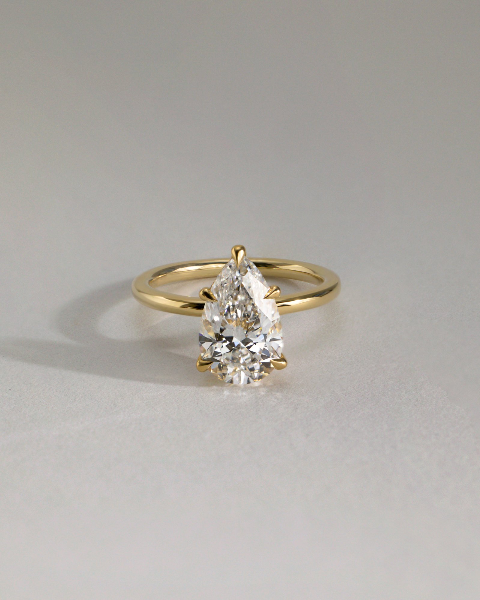 Ainsley - 5 Claw Pear Solitaire with Hidden Halo Lifestyle Image