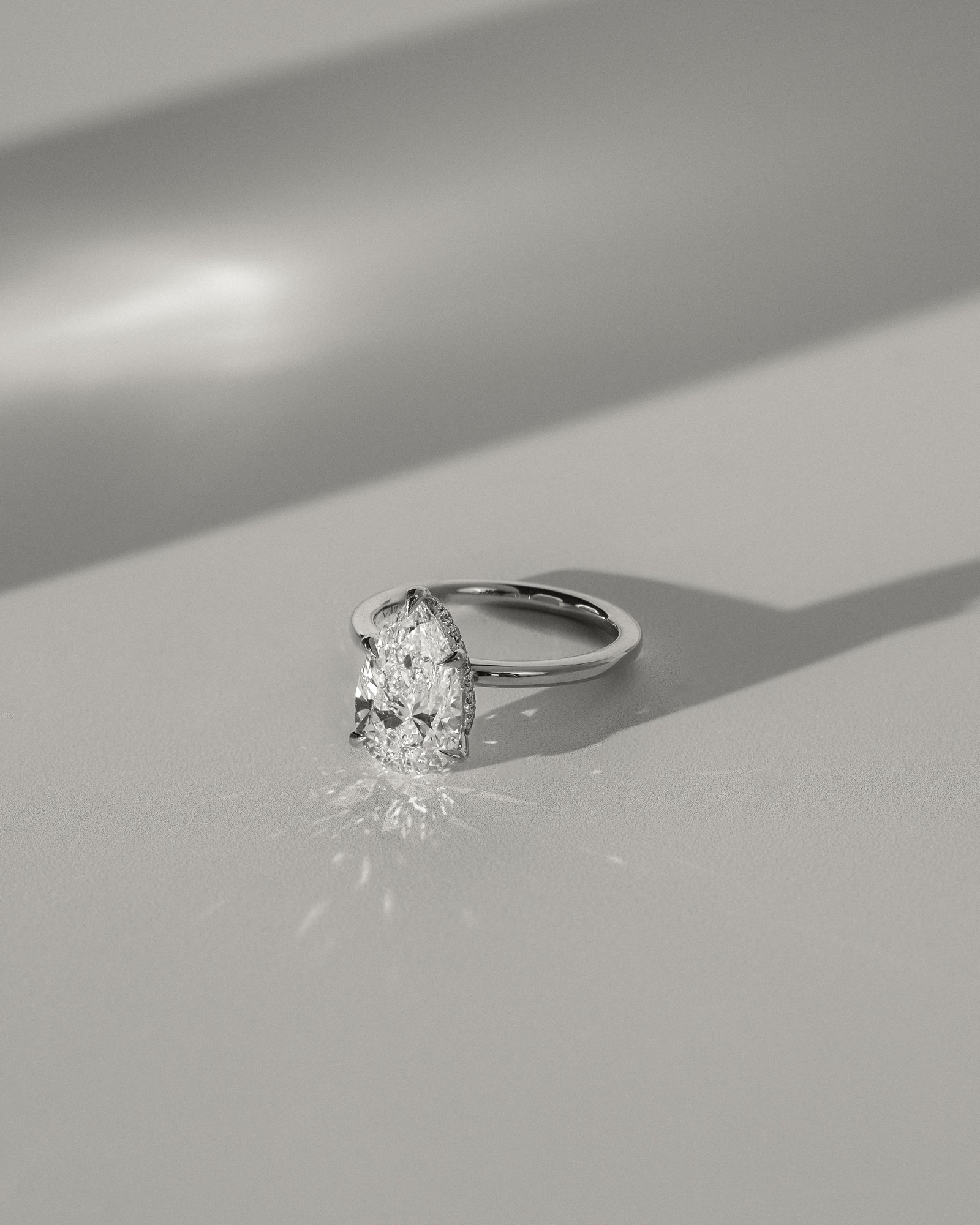 Ainsley - 5 Claw Pear Solitaire with Hidden Halo Lifestyle Image