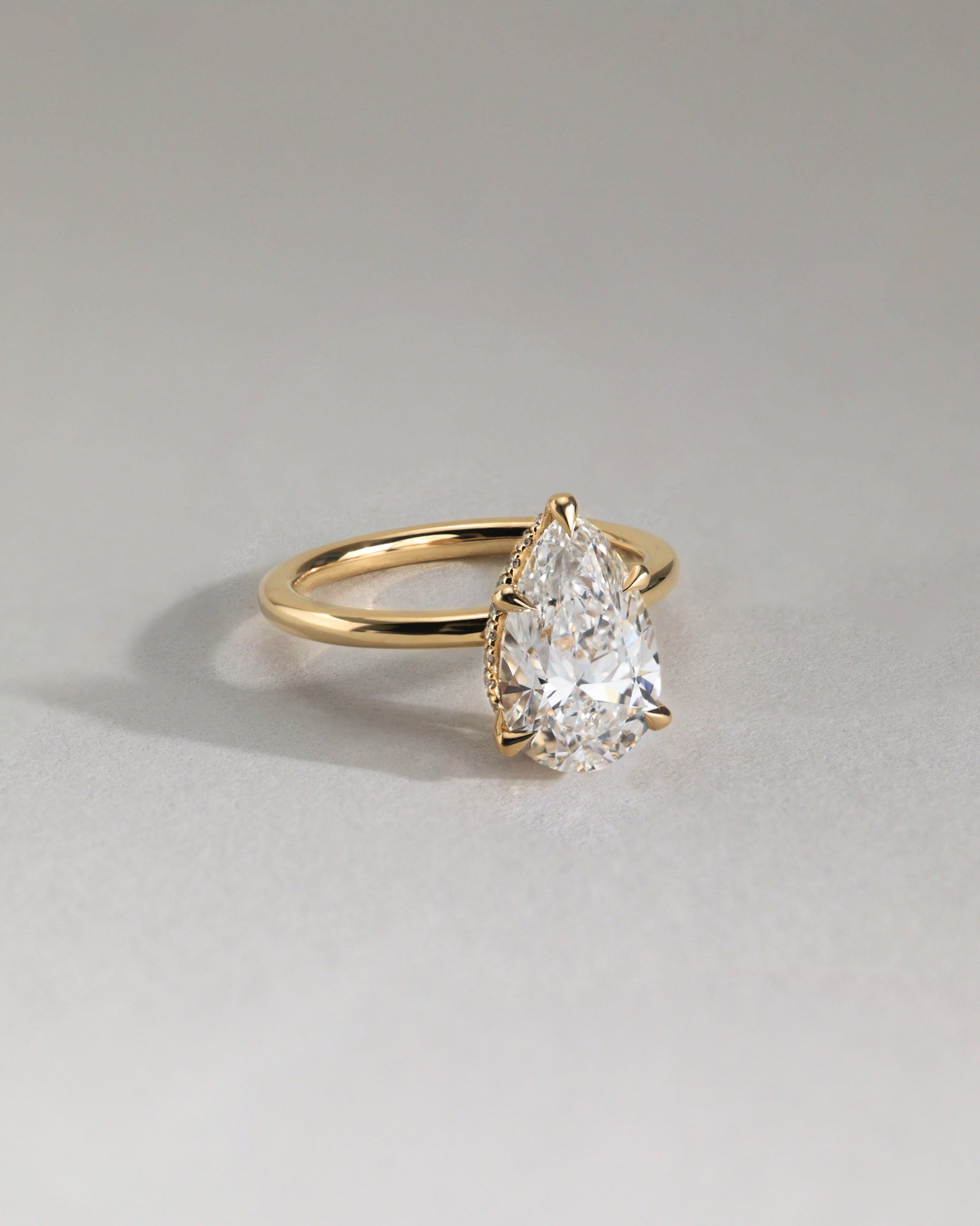 Ainsley - 5 Claw Pear Solitaire with Hidden Halo Lifestyle Image