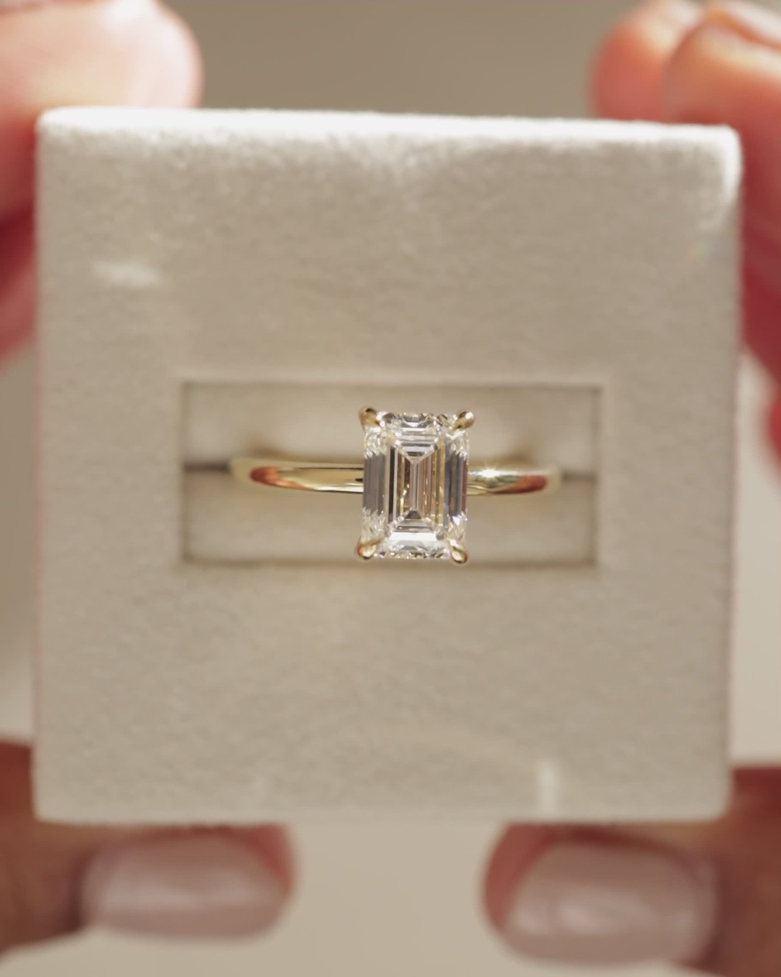 Alina - 4 Claw Emerald Solitaire Lifestyle Image