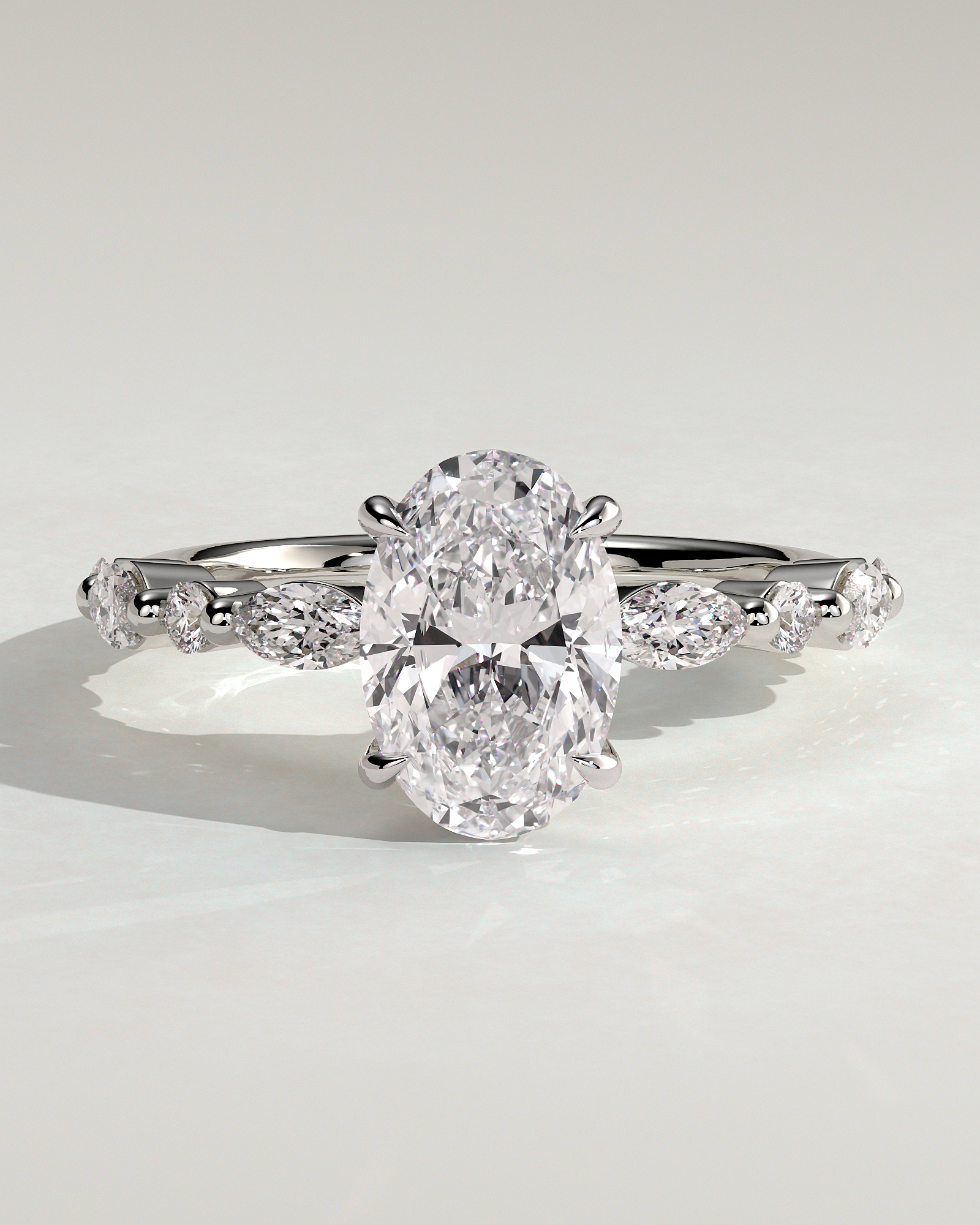 Alyssa - Oval 4 Claw Solitaire with Marquise and Round Accent Stones Engagement Ring - 18k White Gold