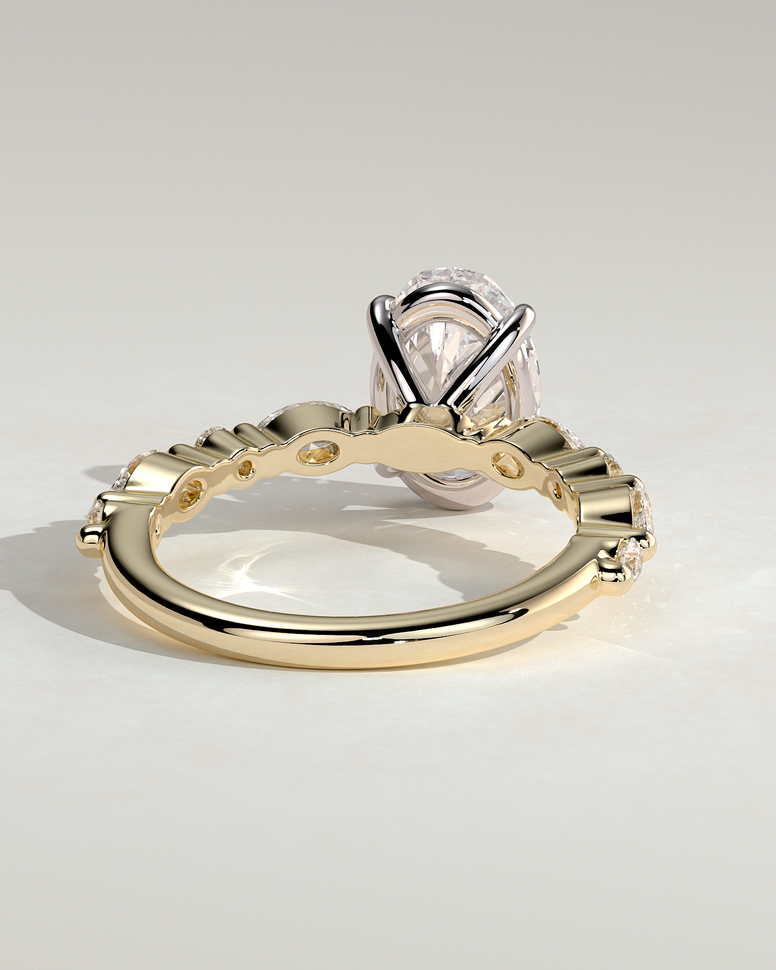 Alyssa - Oval 4 Claw Solitaire with Marquise and Round Accent Stones Engagement Ring - 18k Yellow Gold / 18k White Gold