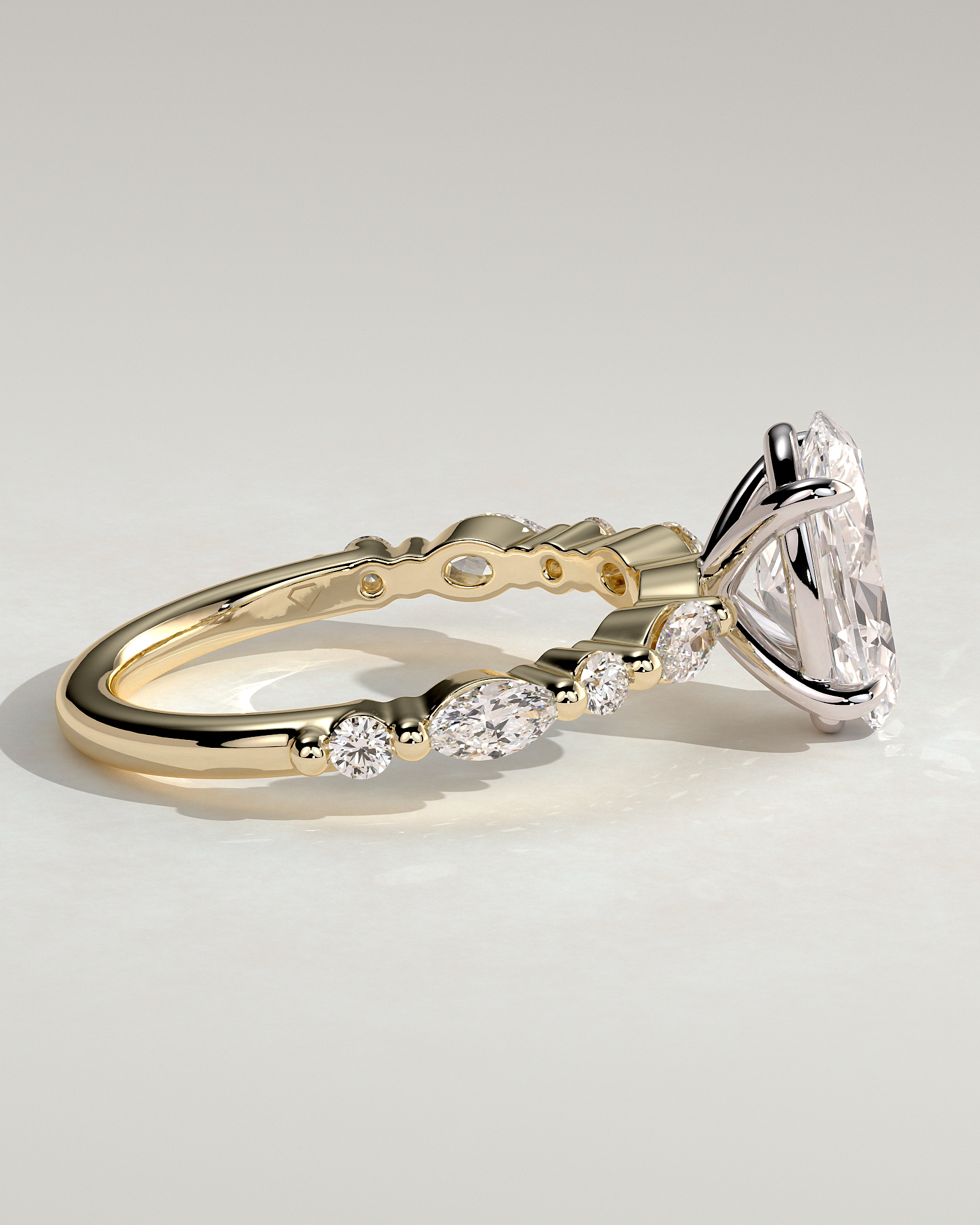 Alyssa - Oval 4 Claw Solitaire with Marquise and Round Accent Stones Engagement Ring - 18k Yellow Gold / 18k White Gold
