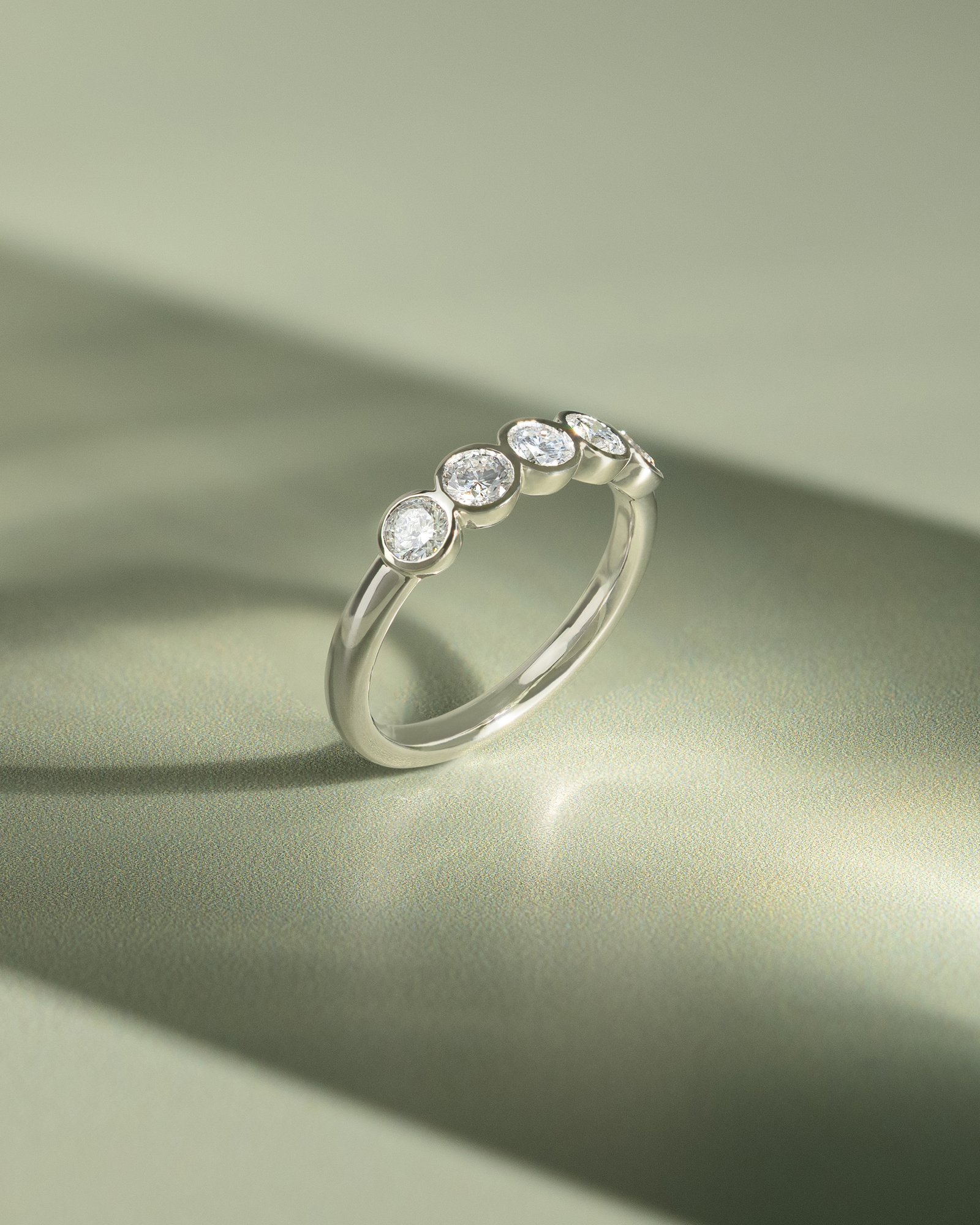 Amber - Bezel Set Round Wedding Ring Lifestyle Image