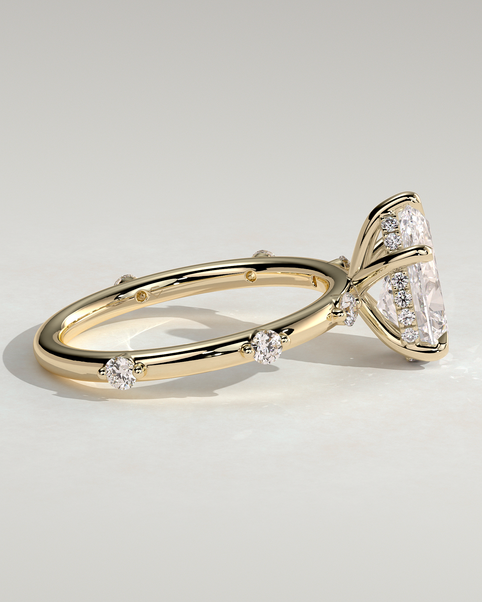 Amora - Pear Solitaire with Round Side Stones - 18k Yellow Gold