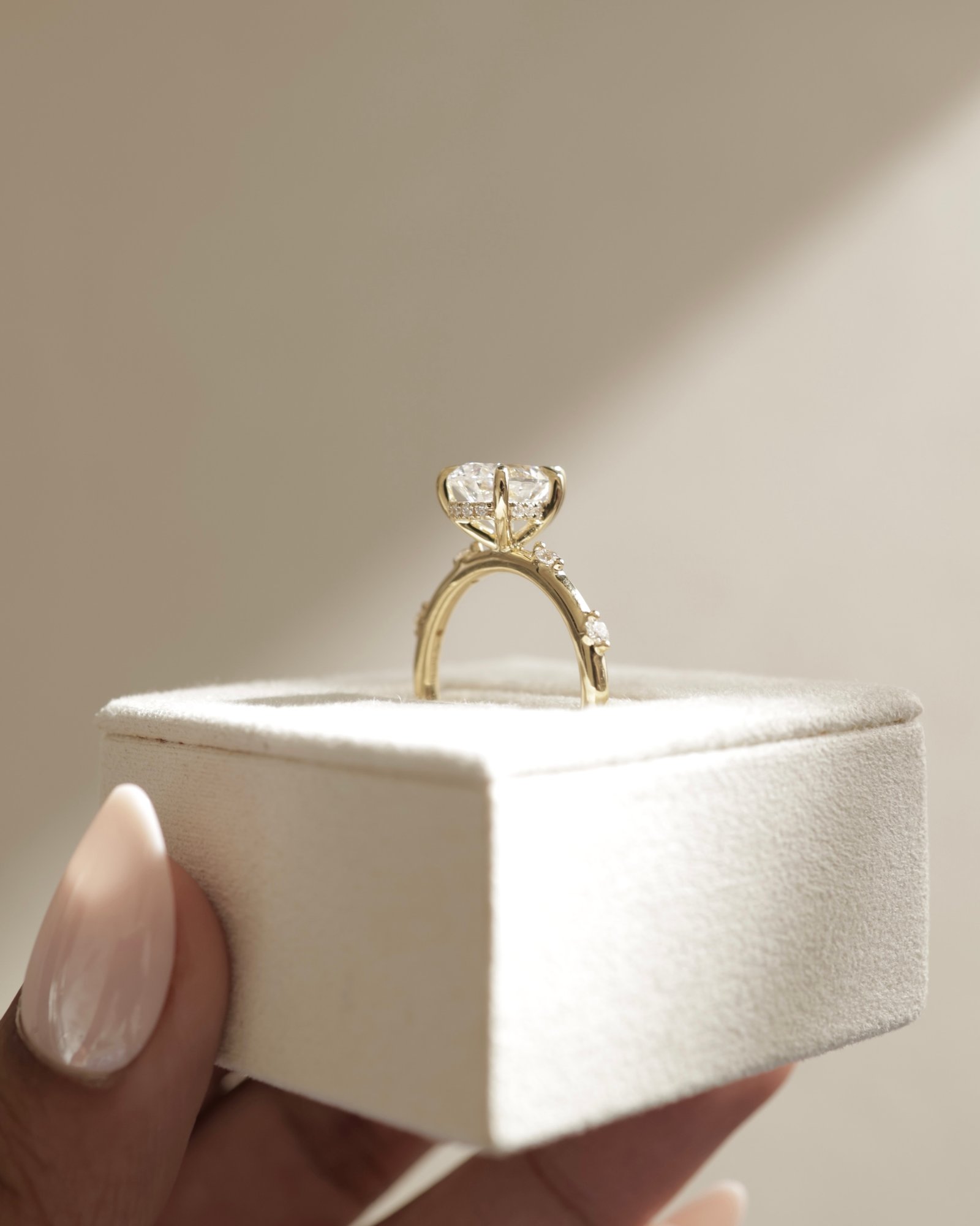 Amora - Pear Solitaire with Round Side Stones Lifestyle Image