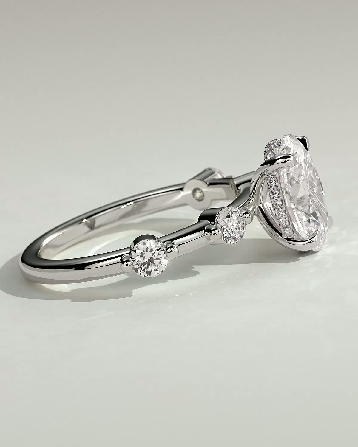 Arwen - Oval Solitaire with Hidden Halo and Accent Stones - 18k White Gold
