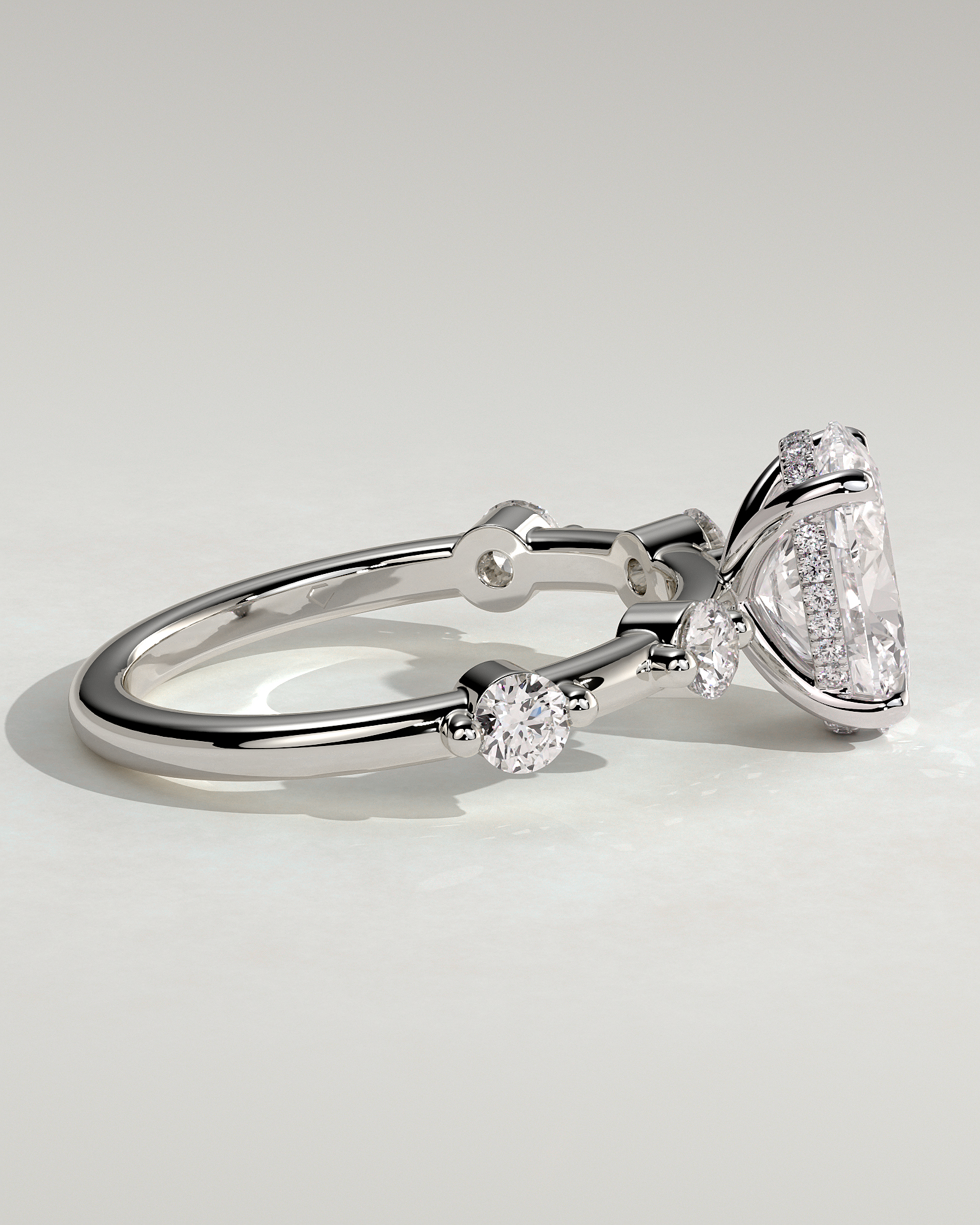 Arwen - Oval Solitaire with Hidden Halo and Accent Stones - 18k White Gold